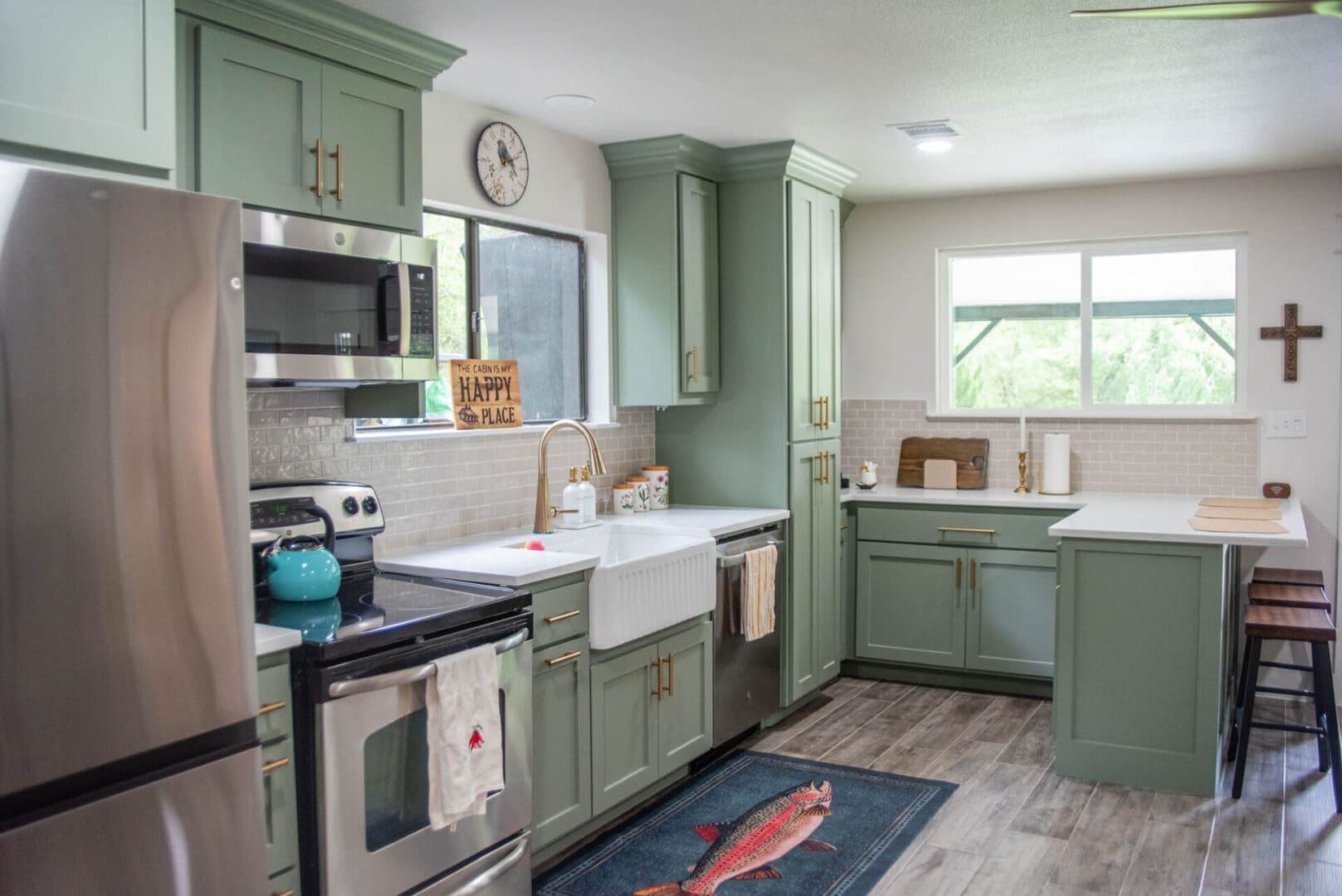 Kitchen with green cabinets and farmhouse sink