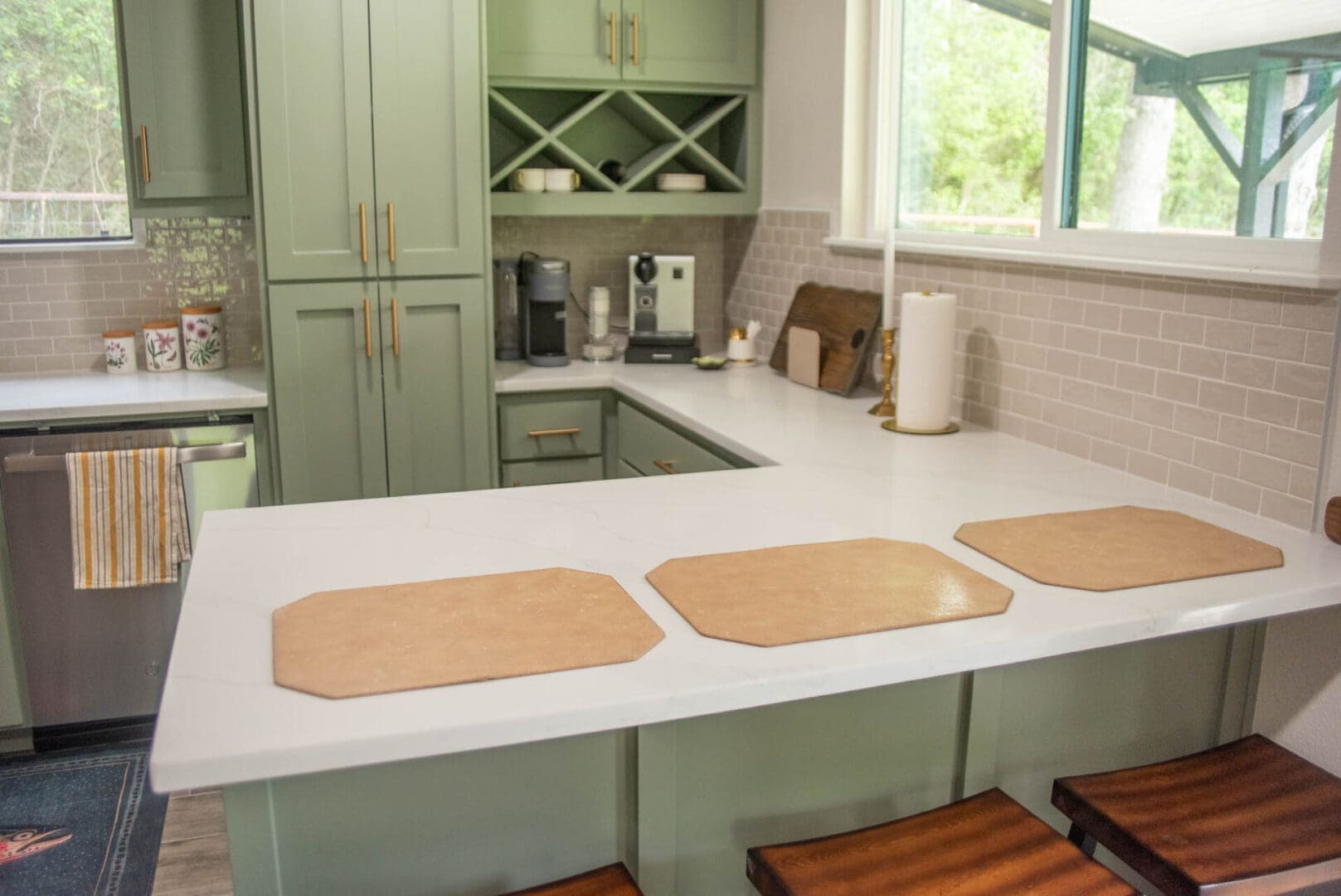 Light green kitchen island with three placemats